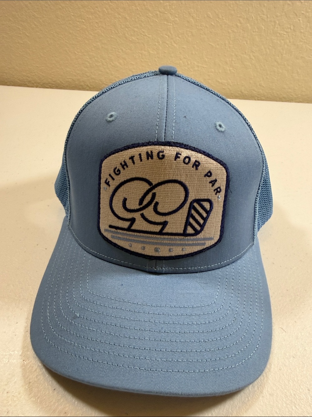 Light Blue Trucker Hat with Embroidered Patch